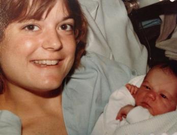 my mom holding me as a baby