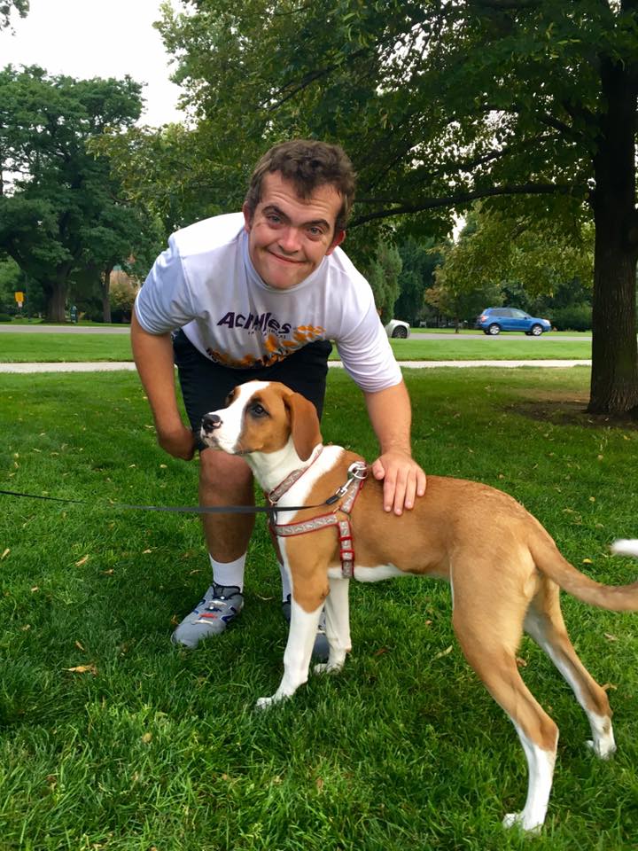 benny petting a dog at the park