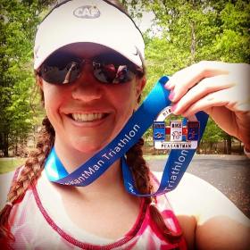 me w/ a medal after completing an olympic distance triathlon