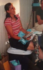 Me at my high school graduation party with my cat leg