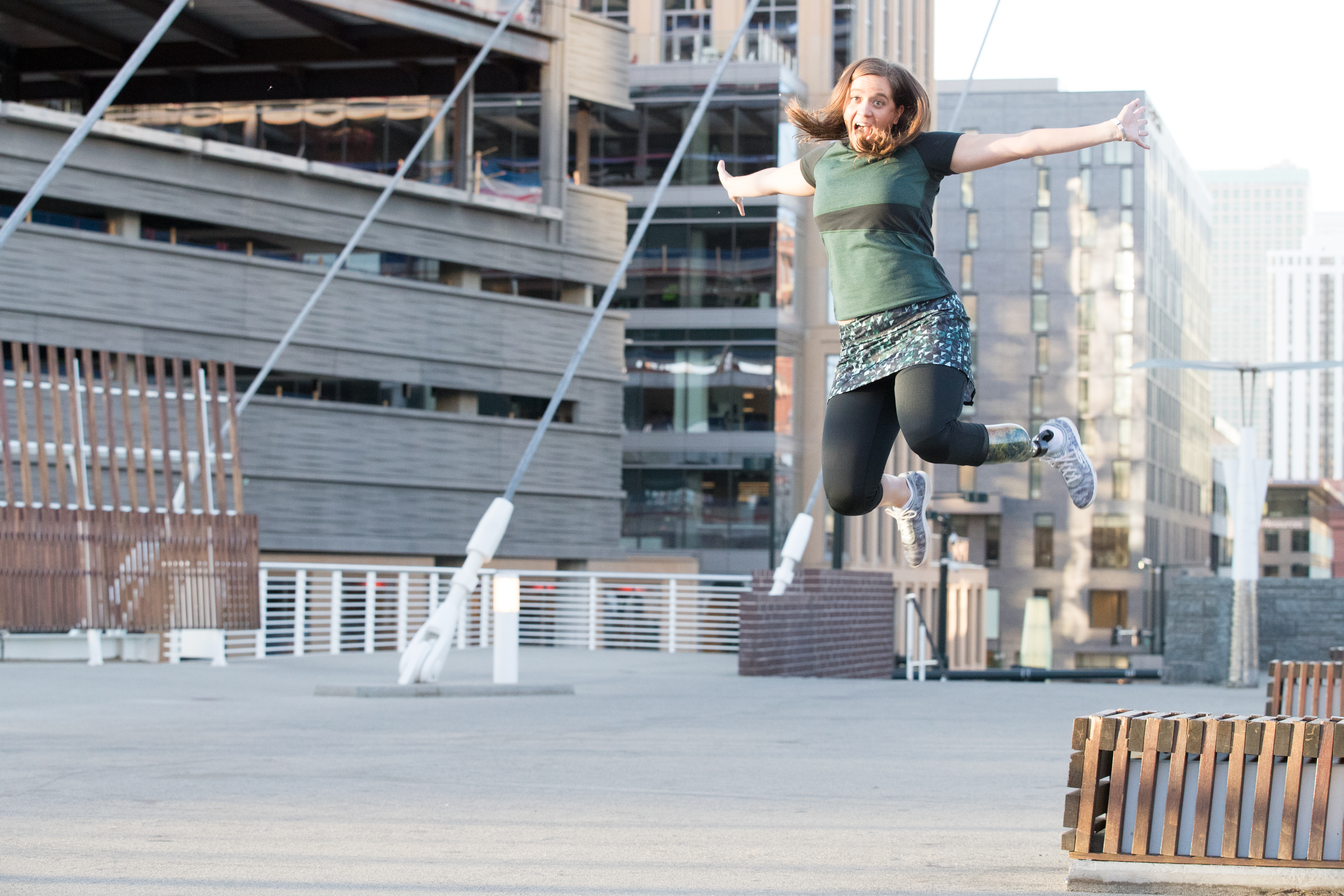 Emily jumping off a bench decked out in Skirt Sports gear