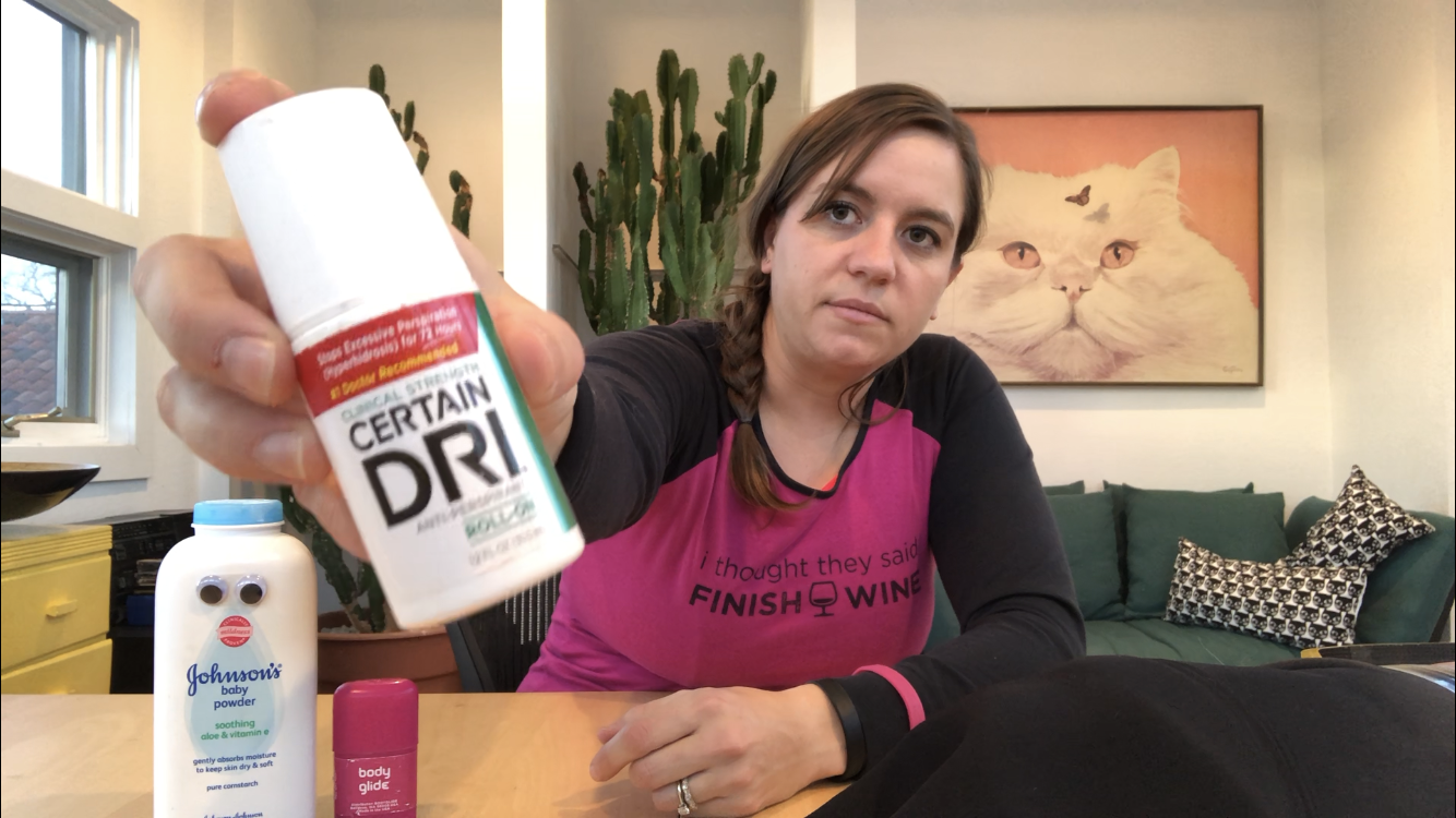 Emily holding CertainDri deodorant/anti-persperant up to the camera