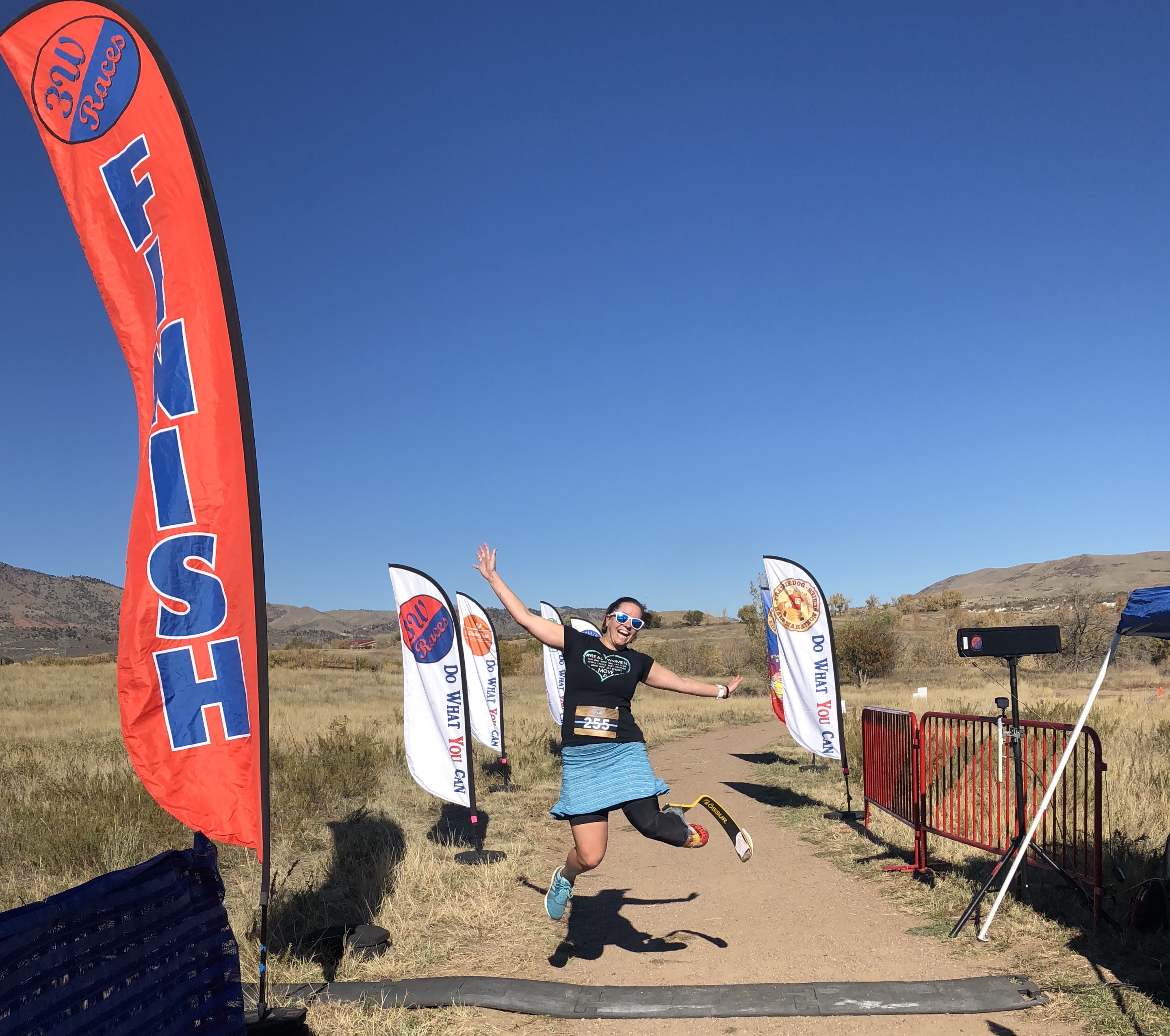 me jumping at the finish line of my first trail race